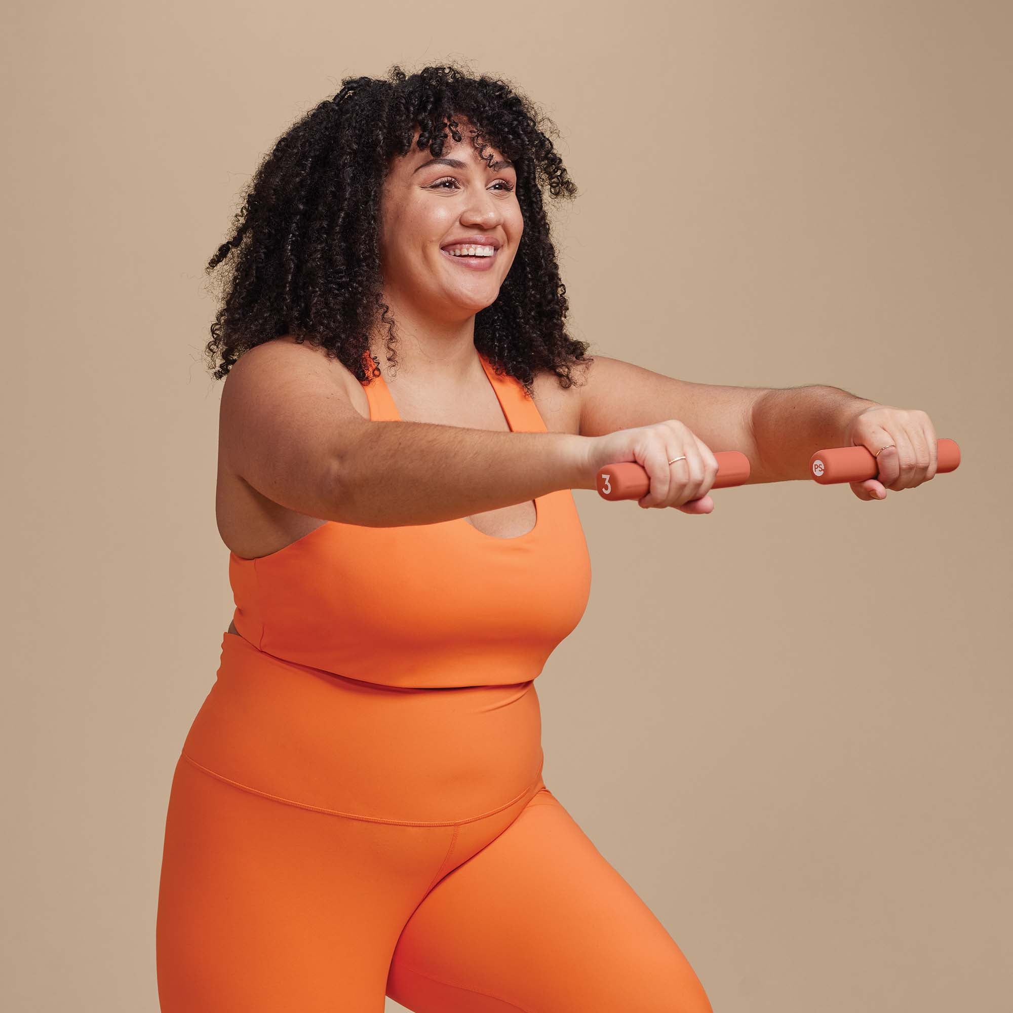 Person doing Front Shoulder Raises with the 3lb POPSUGAR Bar weight - one in each hand